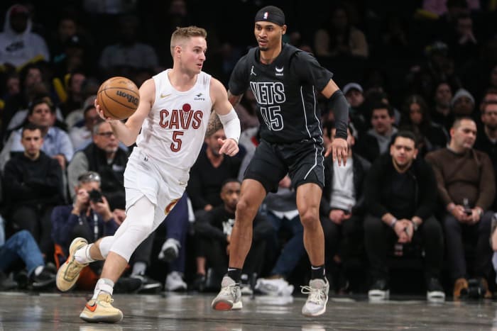 Feb 8, 2024; Brooklyn, New York, USA; Cleveland Cavaliers guard Sam Merrill (5) looks to drive past Brooklyn Nets guard Keon Johnson (45) in the fourth quarter at Barclays Center. Mandatory Credit: Wendell Cruz-USA TODAY Sports